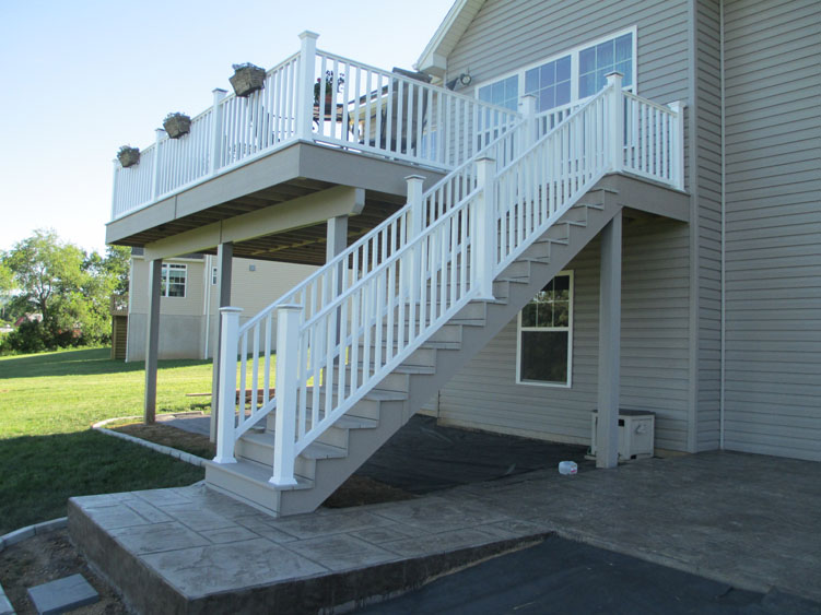 A white and light grey balcony with staircase